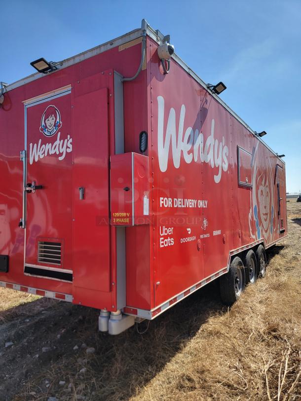 Red Wendy's delivery food trailer, marked for services like Uber Eats and DoorDash; triple axle, exterior in good condition.