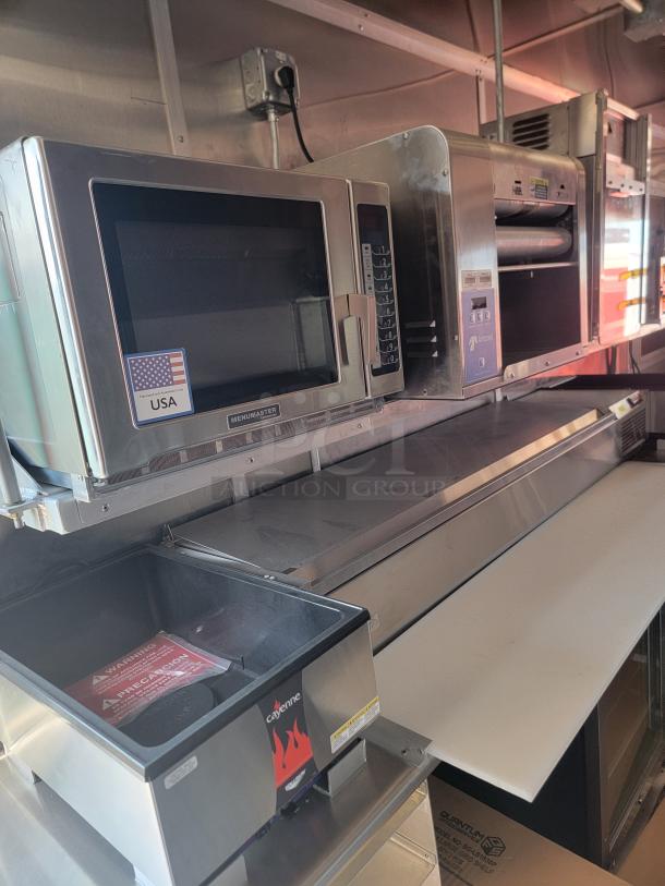 Commercial kitchen equipment including a Menumaster microwave, a conveyor oven, and a Hatco warmer. Good condition.