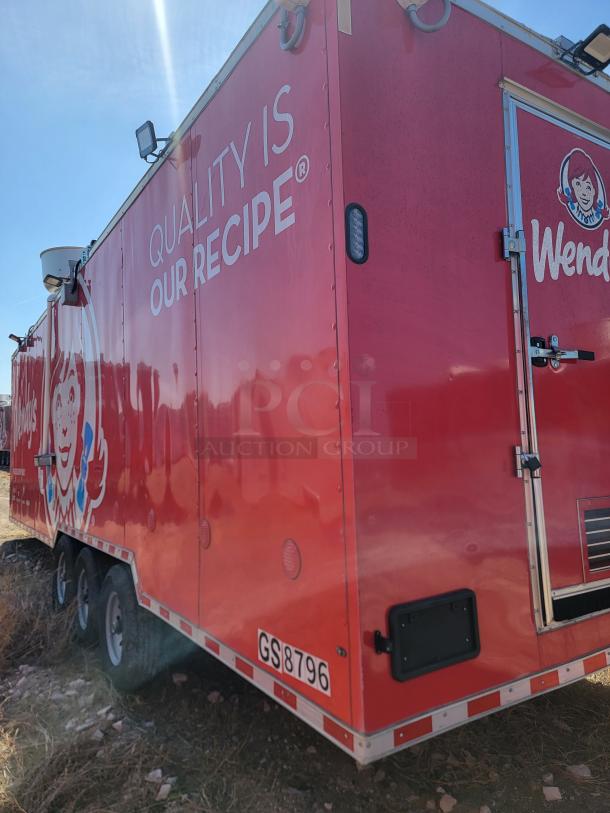 Red Wendy's mobile food trailer with branded graphics and text "QUALITY IS OUR RECIPE." License plate: GS8796.
