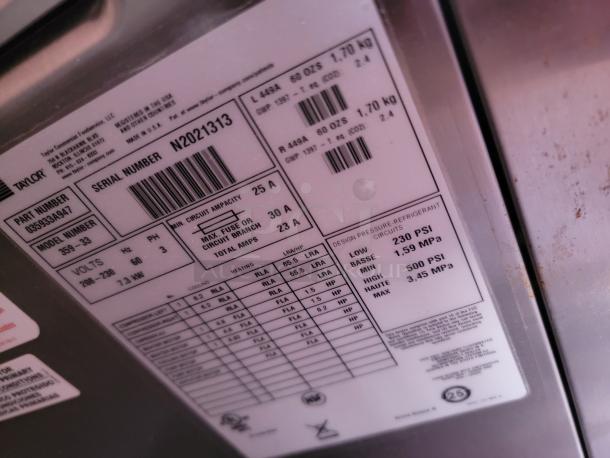 Label on Taylor Model 355-33 with serial number N2021313 showing specifications: 7.3 kW, 208-230 volts, 3 phase, design pressure refrigerant circuits.