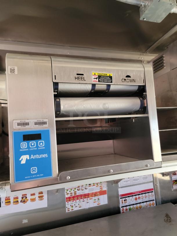 Antunes vertical contact toaster, stainless steel, labeled "Heel" and "Crown," includes controls and safety caution.
