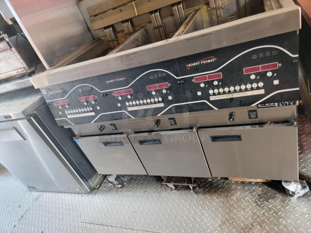 Henny Penny fryer with multiple controls and stainless steel finish. Used condition, suitable for commercial kitchens.