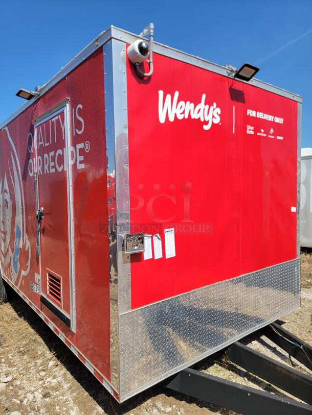 Red Wendy's delivery trailer, featuring logo and "Quality is Our Recipe" slogan. Visible service hatch, security camera, and checklist tags.