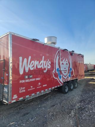 Red Wendy's food delivery trailer with tri-axle; branded logos include Uber Eats, DoorDash, Postmates, and Grubhub.