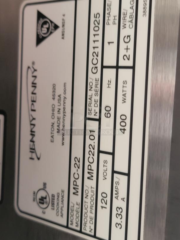 Henny Penny MPC-22 label, showing model MPC22.01, serial GC211025, 120 volts, 400 watts, 3.33 amps, UL listed.