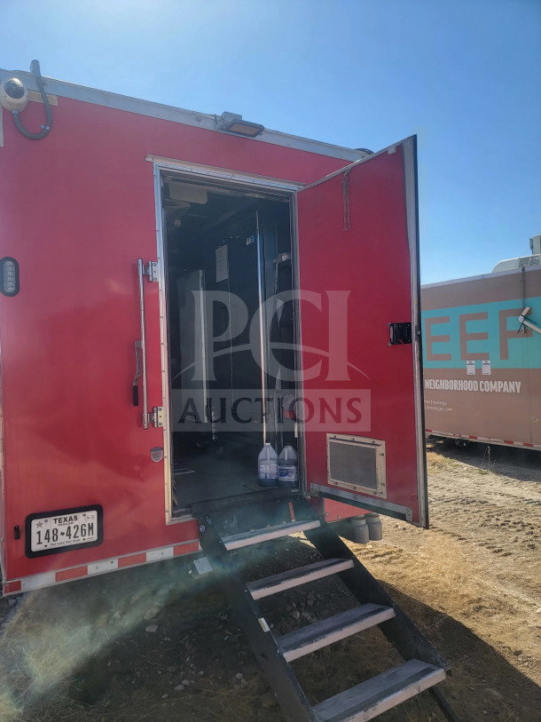 2021 Rock Solid Cargo 8.5' x 28' mobile kitchen trailer, red exterior, open door, Texas plates, VIN 7H2BE2838MD037353.