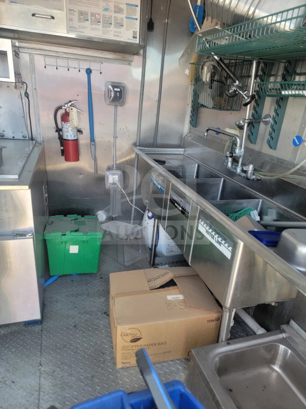2021 Rock Solid Cargo 8.5' x 28' mobile kitchen trailer interior, full kitchen suite, CaptiveAire hood, triple sink setup.