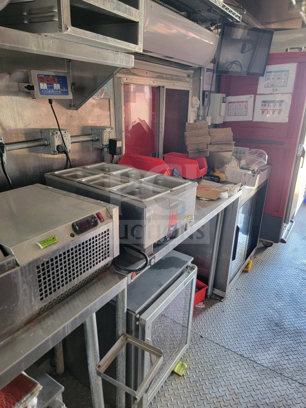 2021 Rock Solid Cargo 8.5' x 28' triple-axle mobile kitchen trailer with CaptiveAire hood and full kitchen suite, 120/208V 3-phase.