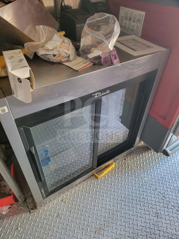 Rock Solid Cargo mobile kitchen trailer, featuring CaptiveAire hood, True refrigeration unit, located inside trailer.