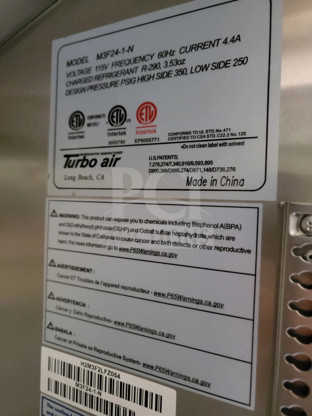 Label on 2021 Rock Solid Cargo mobile kitchen trailer showing model number M3F24-1-N, electrical specifications, and safety warnings.