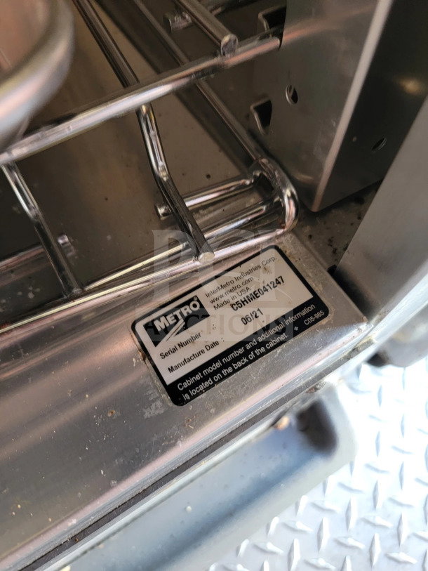 Metallic interior labeled with "Metro" brand. Label shows serial C5HME041247, manufacture date 06/21.