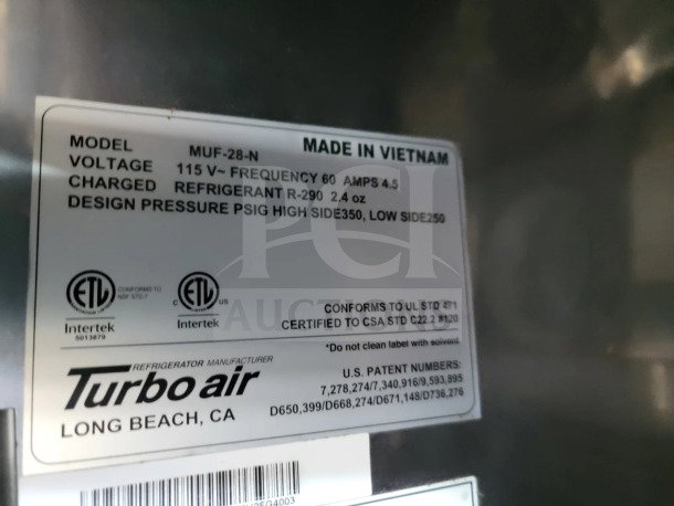 Turbo Air refrigerator label showing model MUF-28-N, voltage 115V, and refrigerant R-290. Made in Vietnam.