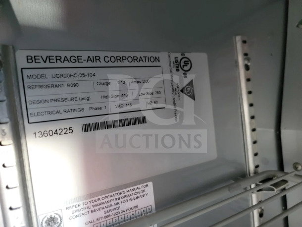 Label inside a Beverage-Air Corporation appliance, Model UCR20HC-25-104, featuring specs on refrigerant, pressure, and electrical ratings.