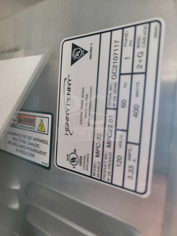 Label on the 2021 Rock Solid Cargo mobile kitchen trailer shows model MPC-22, UL certification, and product specifications.