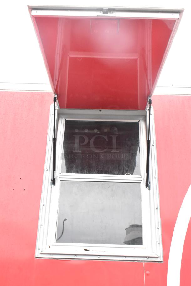 Red Wendy's mobile kitchen trailer with a serving window, showcasing a bright red exterior. New condition, fully equipped.