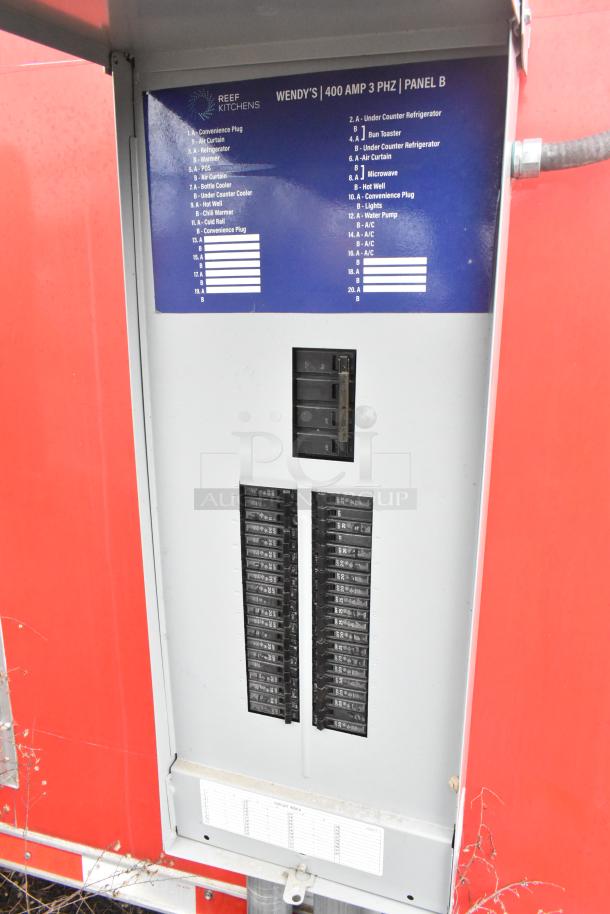 Breaker panel labeled "Wendy's | 400 AMP 3 PHZ | PANEL B" in a mobile kitchen trailer with circuit listings for various appliances.