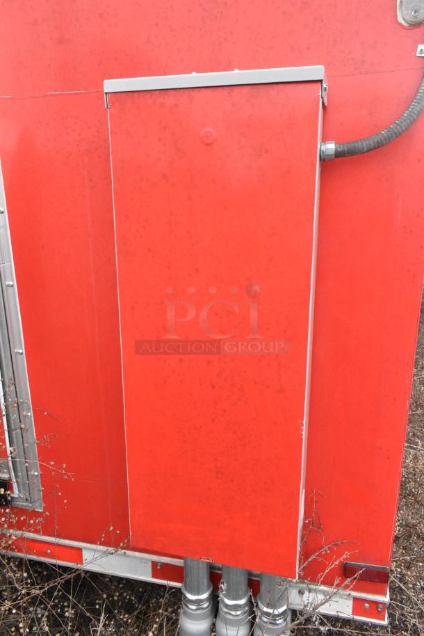 Red Wendy's Mobile Kitchen Trailer exterior, showing metal panel and conduit. Unused condition, clear title, fully equipped.
