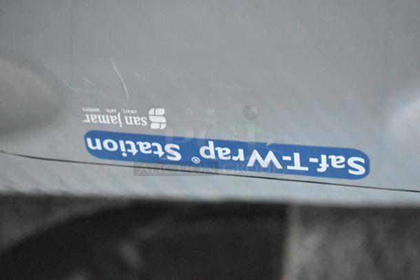 San Jamar paper towel dispenser with Saf-T-Wrap Station label, part of a fully equipped mobile kitchen trailer.