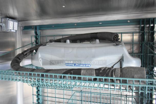 Wendy's mobile kitchen trailer interior with wire shelving and HVAC unit, showing clean condition and secure wiring.