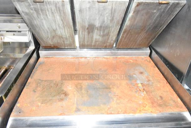 Wendy's mobile kitchen trailer grill, rusted surface, stainless steel, equipped with grease hood. Excellent auction item.