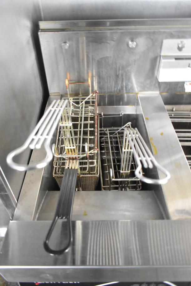 Henny Penny Evolution Elite 3-Bay Gas Fryer inside brand new Wendy's mobile kitchen trailer, with fryer baskets.