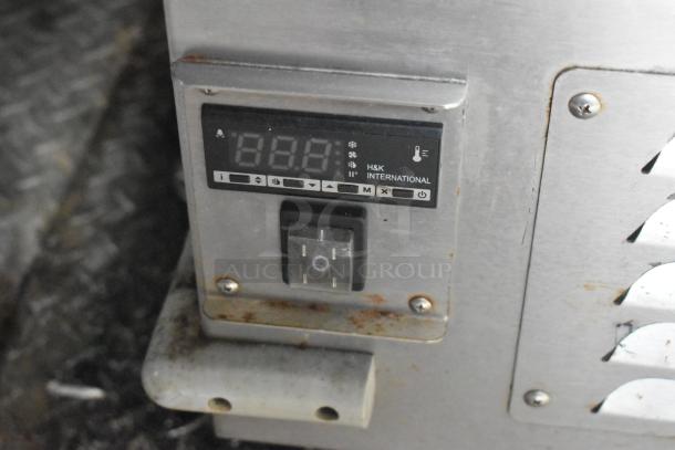 Control panel for Wendy's Mobile Kitchen with H&K International display, temperature settings, and toggle switch, slightly rusted.