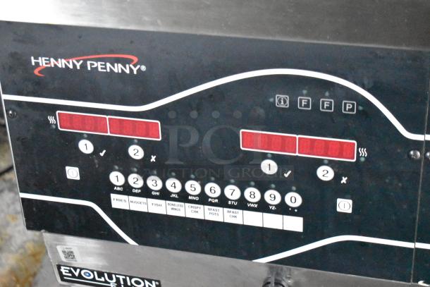 Control panel of Henny Penny Evolution Elite 3-Bay Gas Fryer, featuring buttons for various cooking modes.