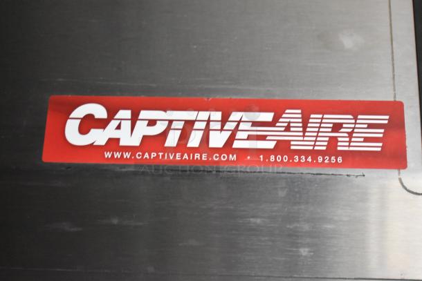 CaptiveAire label on stainless steel surface, featuring website and contact number.