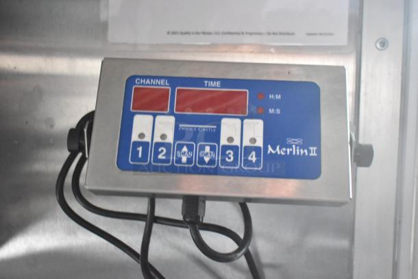 Merlin II control panel in a new Wendy's mobile kitchen trailer, featuring channel and time settings.