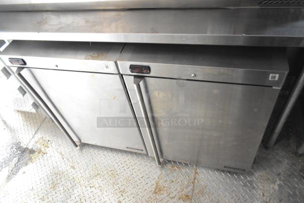 Stainless steel refrigeration units inside a fully equipped 8.5' x 28' Wendy's mobile kitchen trailer.