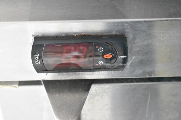 Close-up of a Carel control panel on new Wendy's Mobile Kitchen Trailer equipment, showing digital display and buttons.