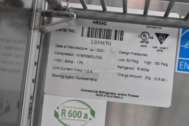 Label on commercial refrigerator, model HR24C, manufactured July 2021. Contains refrigerant R-600a, 115V, 60Hz, with 1.0A current draw.