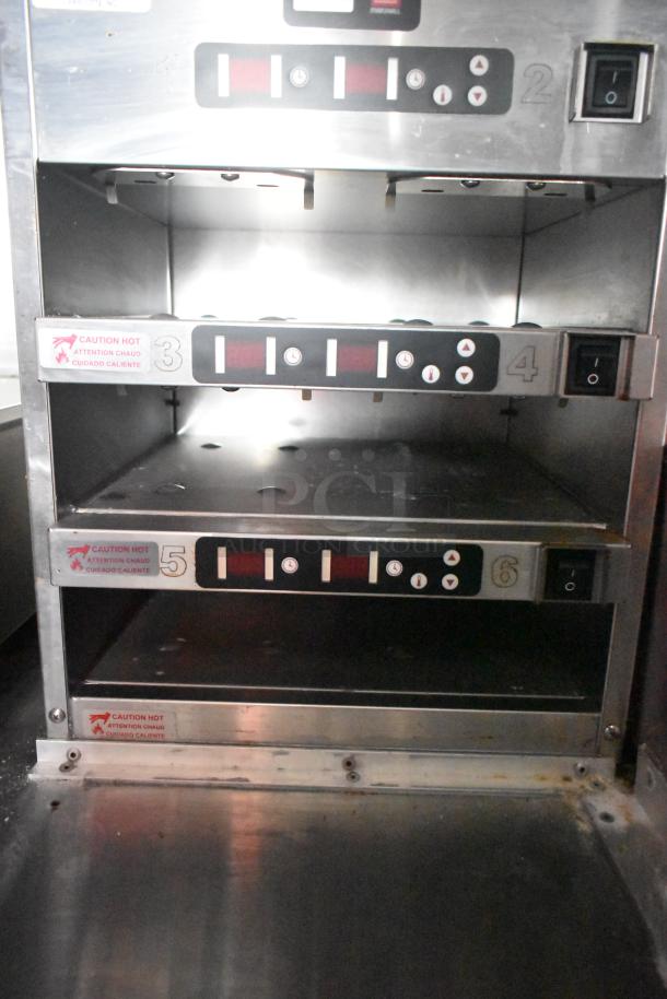 Metro C5 holding cabinet interior; stainless steel with digital controls; caution hot label; excellent condition.