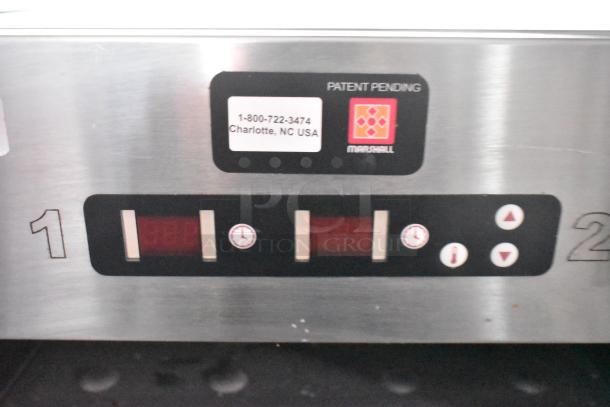 Control panel of the Wendy's mobile kitchen trailer featuring digital displays and buttons with a "Patent Pending" label.