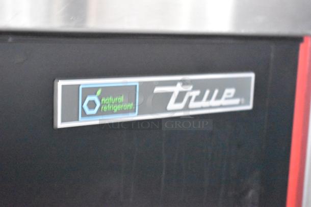 True refrigeration unit label with "natural refrigerant" text, highlighting eco-friendly feature in Wendy's mobile kitchen trailer.