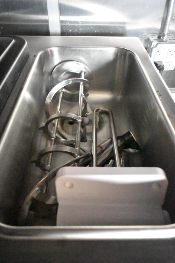 Interior view of a Wendy's mobile kitchen trailer showing stainless steel equipment, demonstrating new, unused condition.