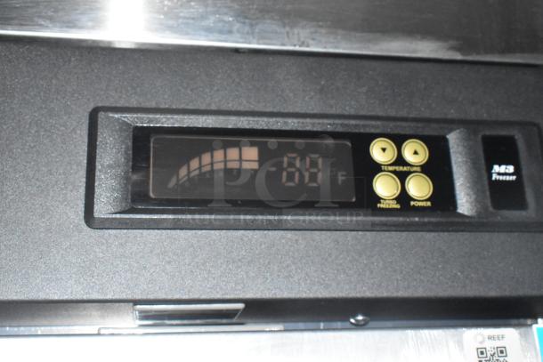 Close-up of digital temperature control display on new mobile kitchen trailer equipment, showing -88°F with temperature and power buttons.