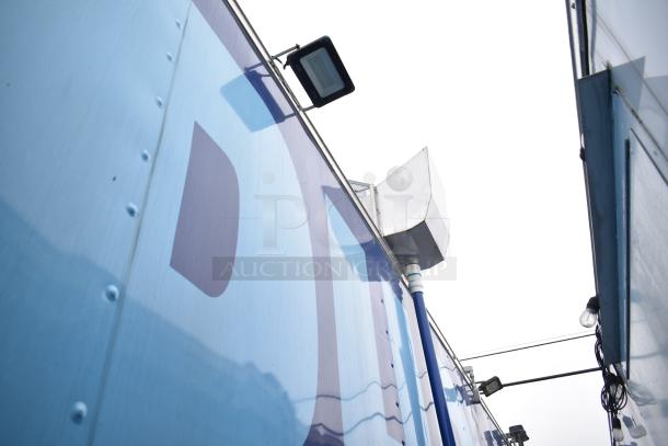 2021 Rock Solid Cargo 28' fast food trailer exterior with lighting fixtures; suited for a mobile kitchen setup.