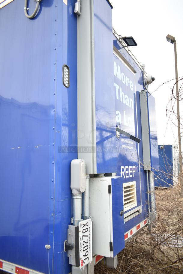 2021 Rock Solid Cargo 28' fast food trailer, blue exterior, equipped with commercial-grade kitchen appliances. Clear title.