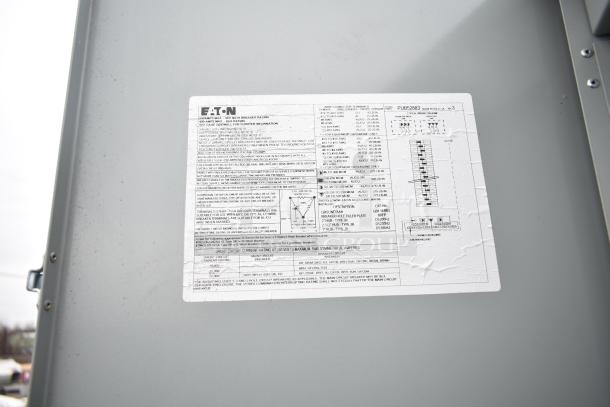 Label on Rock Solid Cargo mobile kitchen trailer, details electrical specifications and installation instructions by Eaton.