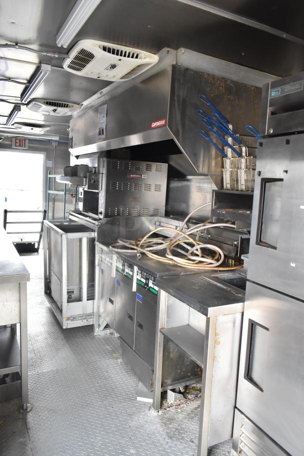 2021 Rock Solid Cargo 28' fast food trailer with CaptiveAire hood, Nieco broiler, Frymaster fryer, True freezers.