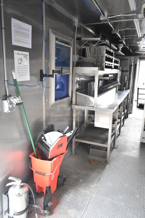 2021 Rock Solid Cargo 28' mobile kitchen trailer with stainless steel workstations, commercial appliances, and clear title.