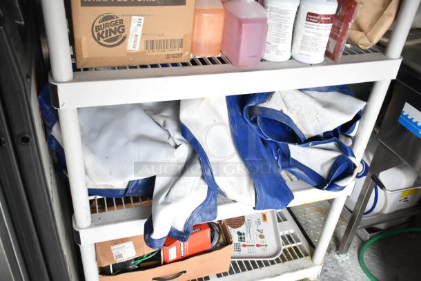 2021 Rock Solid Cargo 28' fast food trailer interior, featuring Burger King packaging and cleaning supplies on shelves.