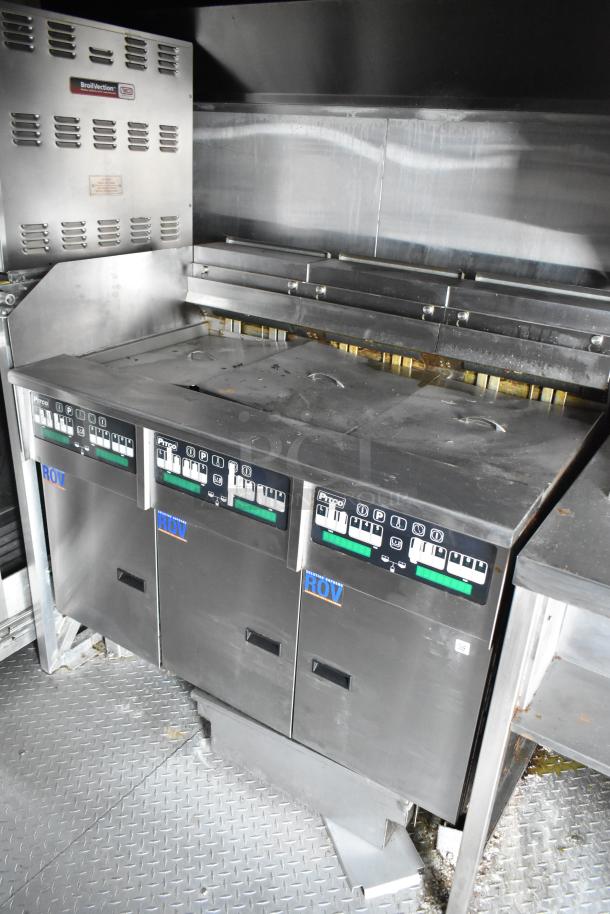 2021 Rock Solid Cargo 28' fast food trailer featuring Pitco fryers, grease hood, and commercial equipment. Ideal for mobile kitchen.