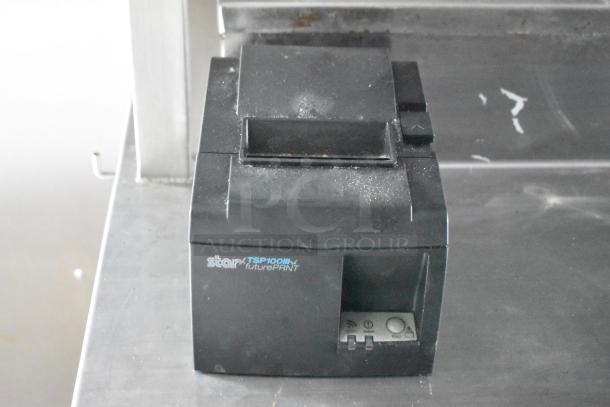 Star TSP100III printer on a steel surface, used in a 2021 Rock Solid Cargo fast food trailer. Dusty condition.