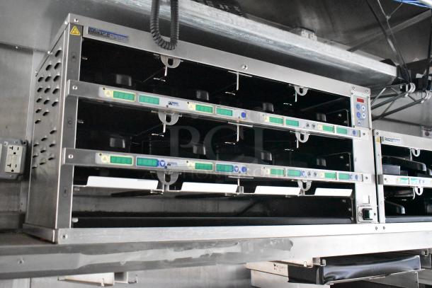 Alt text: Stainless steel commercial Prince Castle holding bins in Rock Solid Cargo mobile kitchen trailer.