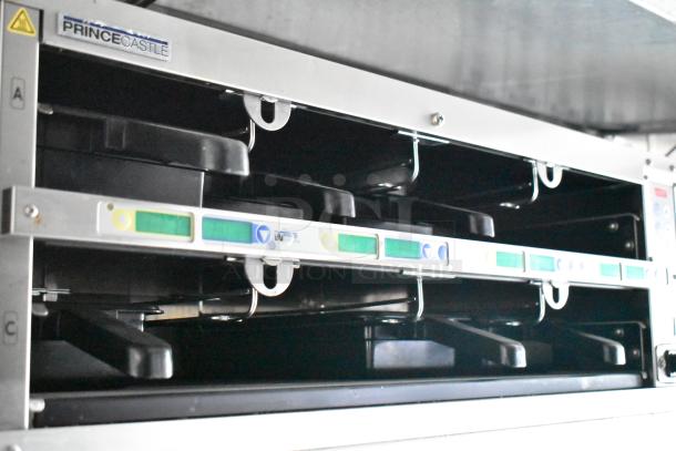 Prince Castle holding bins with labeled controls inside 2021 Rock Solid Cargo fast food trailer, excellent condition.