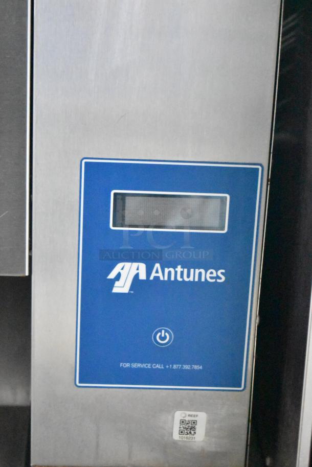 Antunes commercial kitchen appliance panel with blue branding and service contact information displayed.