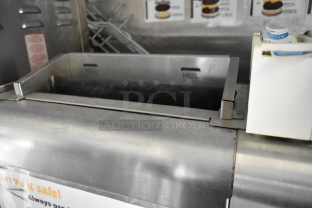 2021 Rock Solid Cargo 28' fast food trailer with stainless steel counters and dedicated holding bins; commercial equipment included.