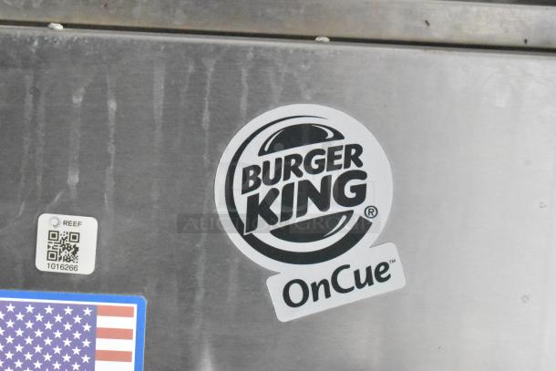 2021 Rock Solid Cargo Burger King mobile kitchen trailer, showing brand logo and QR code on stainless steel surface.